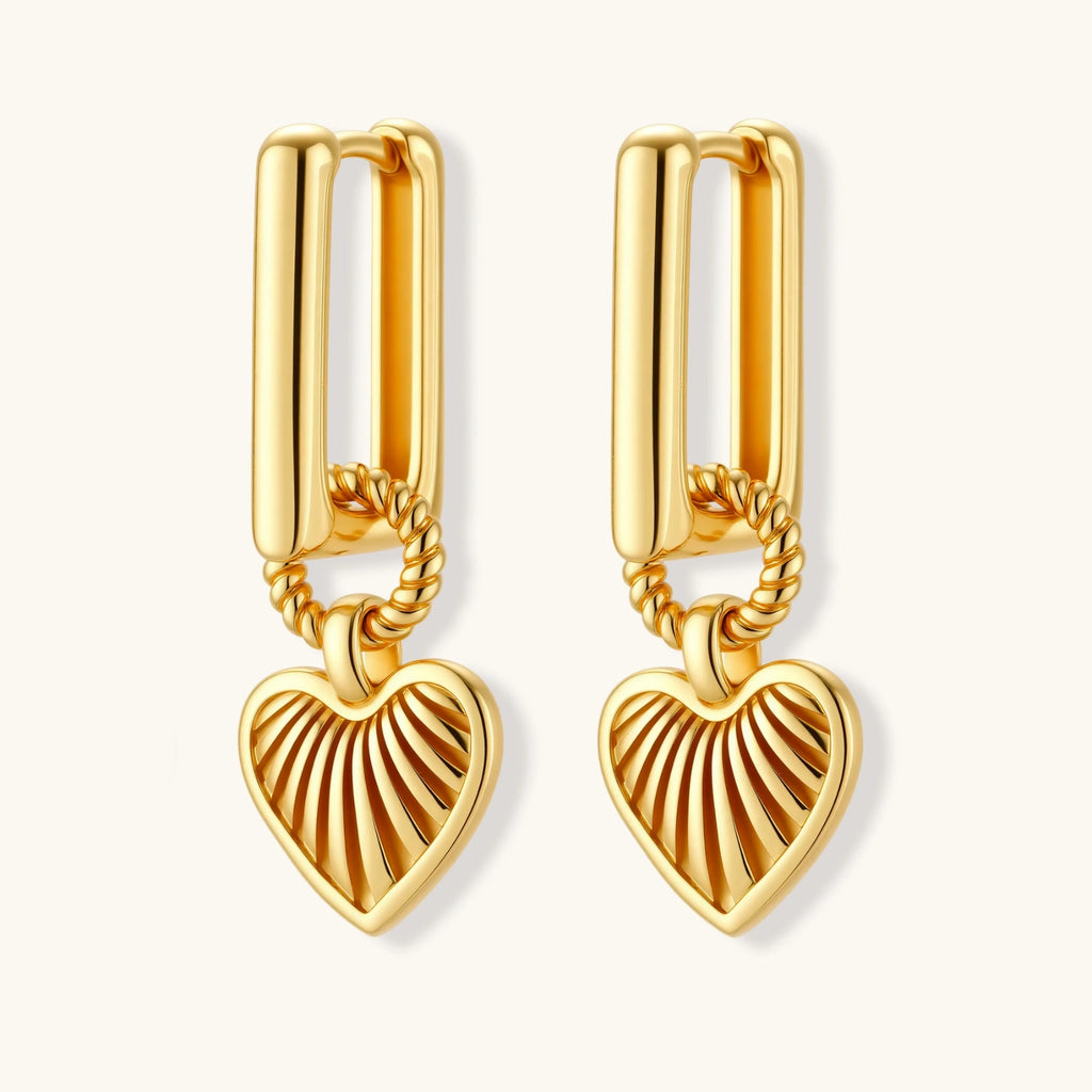 18K gold-plated rectangular huggie hoops with twisted rope ring and ribbed sunray heart charm pendant, on white background.