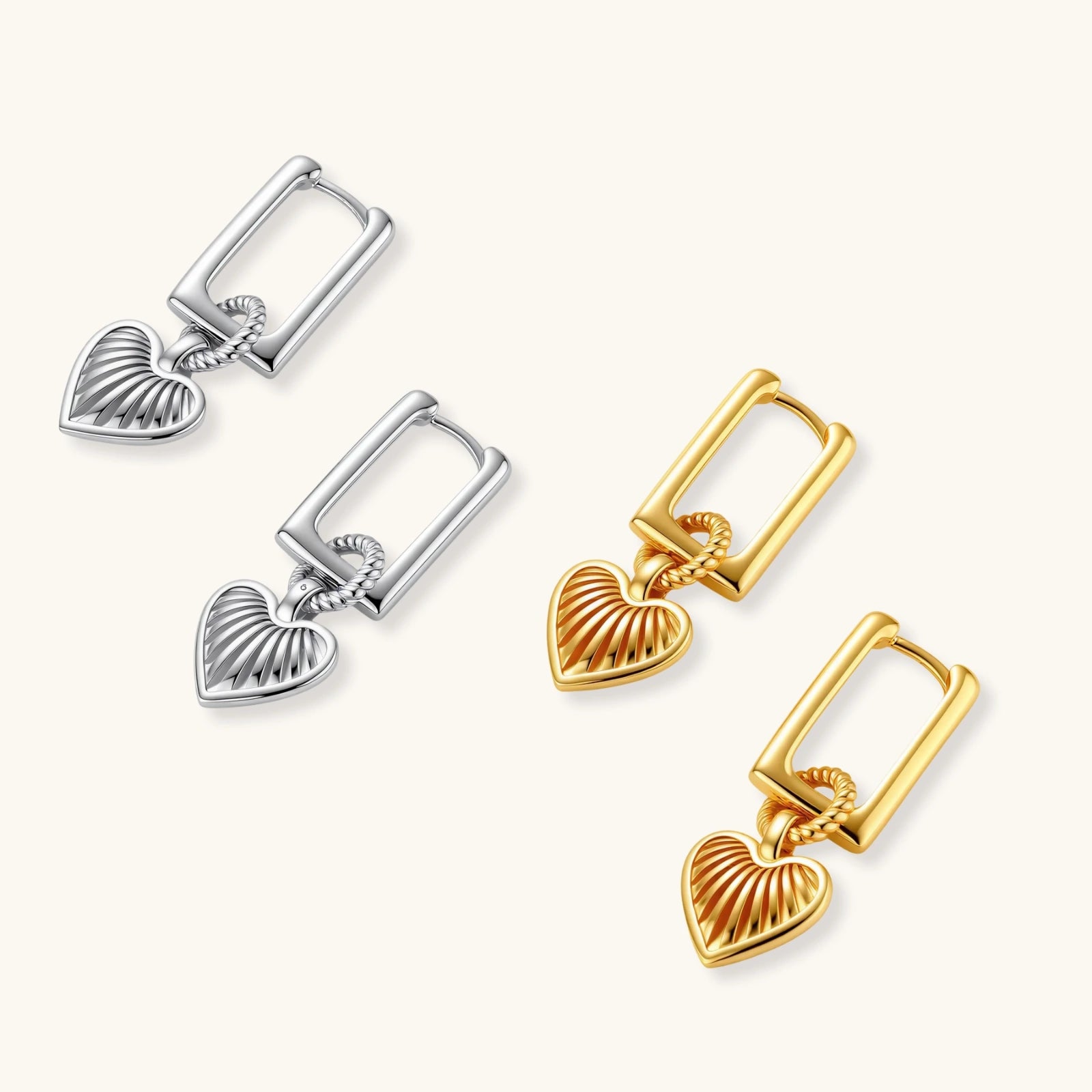 18K gold-plated rectangular huggie hoops with twisted rope ring and ribbed sunray heart charm pendant, on white background.