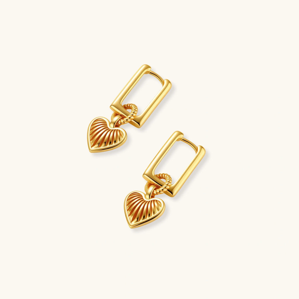 18K gold-plated rectangular huggie hoops with twisted rope ring and ribbed sunray heart charm pendant, on white background.